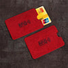 A set of five red RFID protection cards and a yellow UnionPay card displayed on a dark fabric surface.