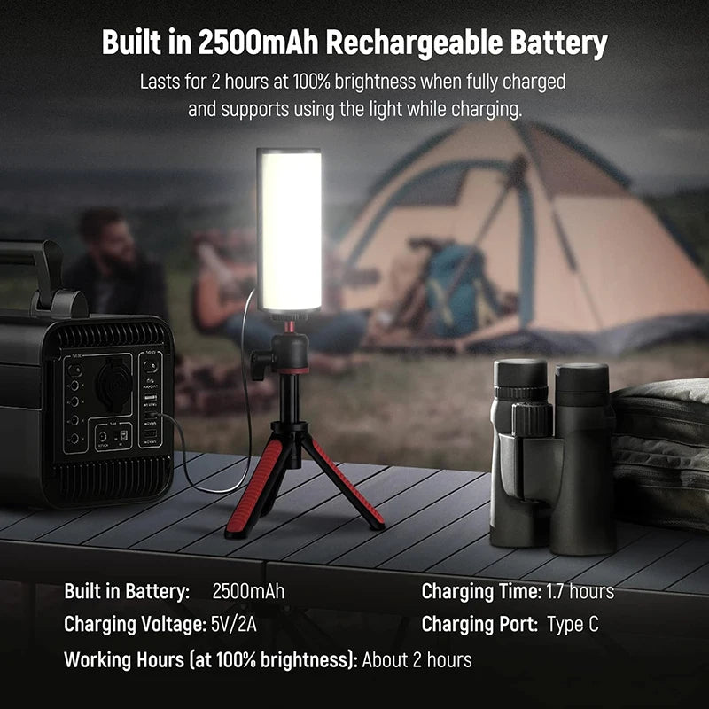 A portable LED light wand is shown next to a camera and a tent in an outdoor setting.