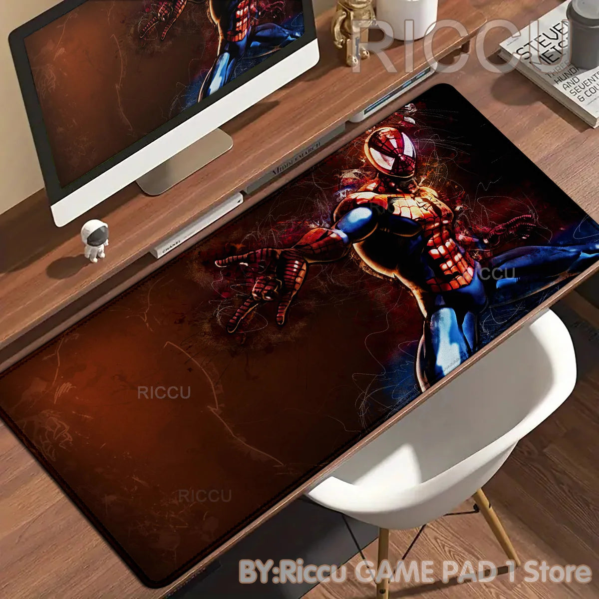 A dark brown desk mat featuring a Spider-Man character design for a gaming mouse pad.