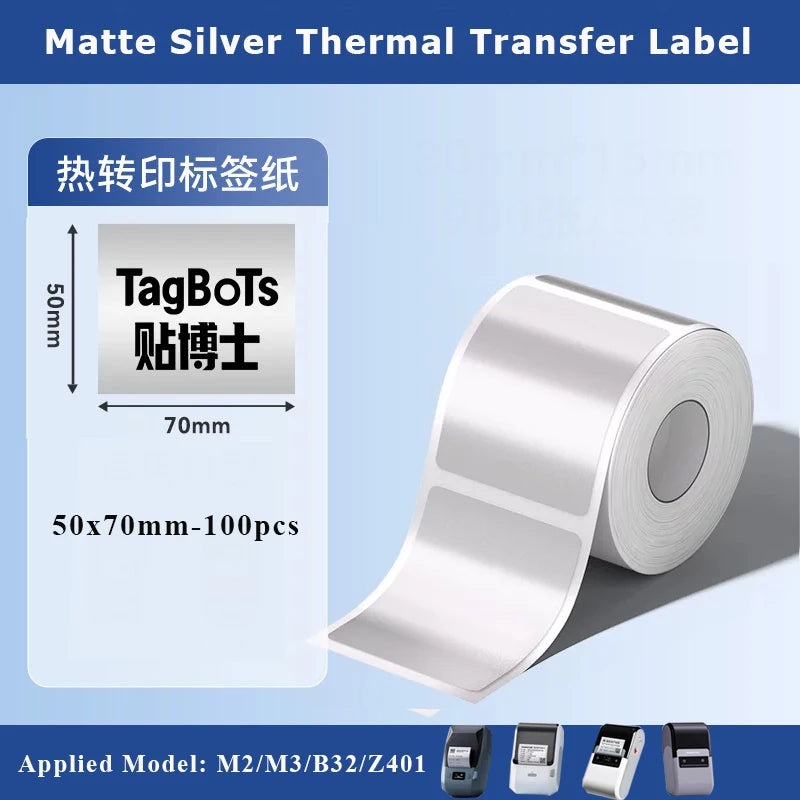Roll of matte silver thermal transfer labels with TagBoTs printed on them