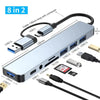 A silver USB hub docking station with multiple ports and a cable, including USB-C and USB 3.0 connectors.