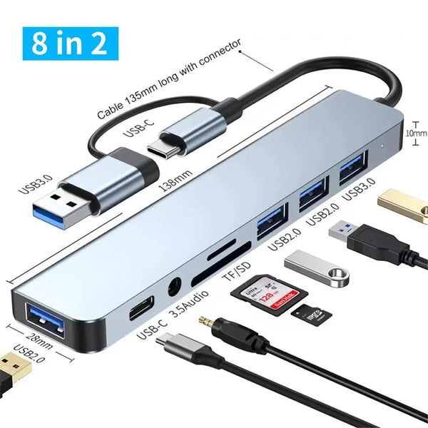 A silver USB hub docking station with multiple ports and a cable, including USB-C and USB 3.0 connectors.