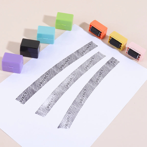A collection of colorful privacy protection roller stamps arranged diagonally on a white sheet of paper.