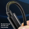 A close-up of a black braided thread charging cable being held by a hand.