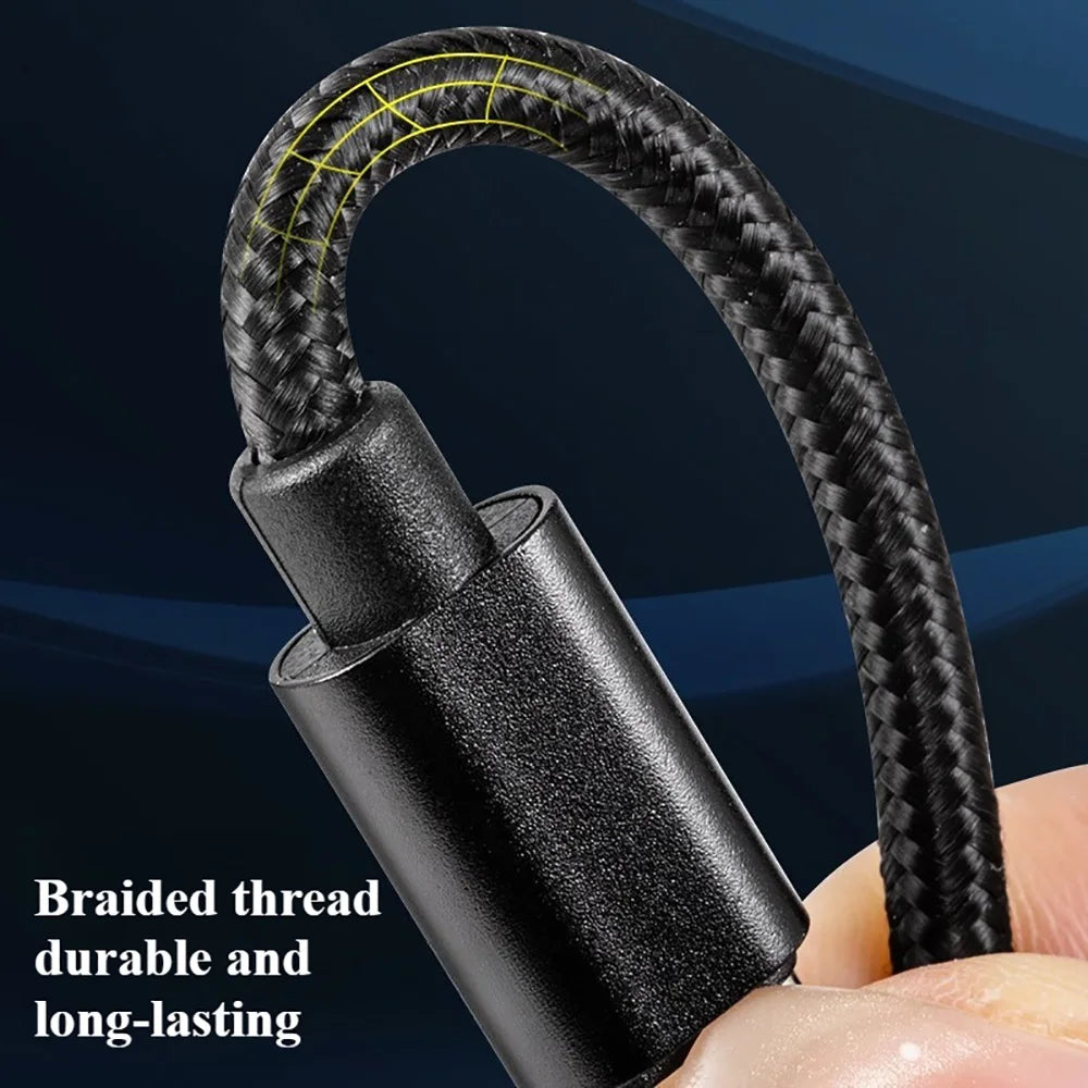 A close-up of a black braided thread charging cable being held by a hand.