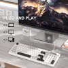 A white membrane keyboard is shown next to a computer monitor displaying a dramatic fantasy scene, with plug and play connect