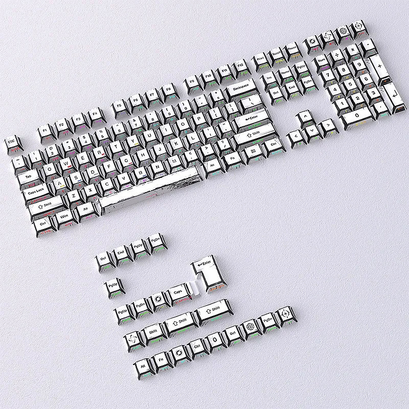 A close-up view of a full set of translucent PBT keycaps with side printing in a cherry profile layout.