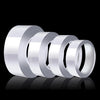 Rolls of heavy duty nano double-sided adhesive tape displayed on a reflective surface.