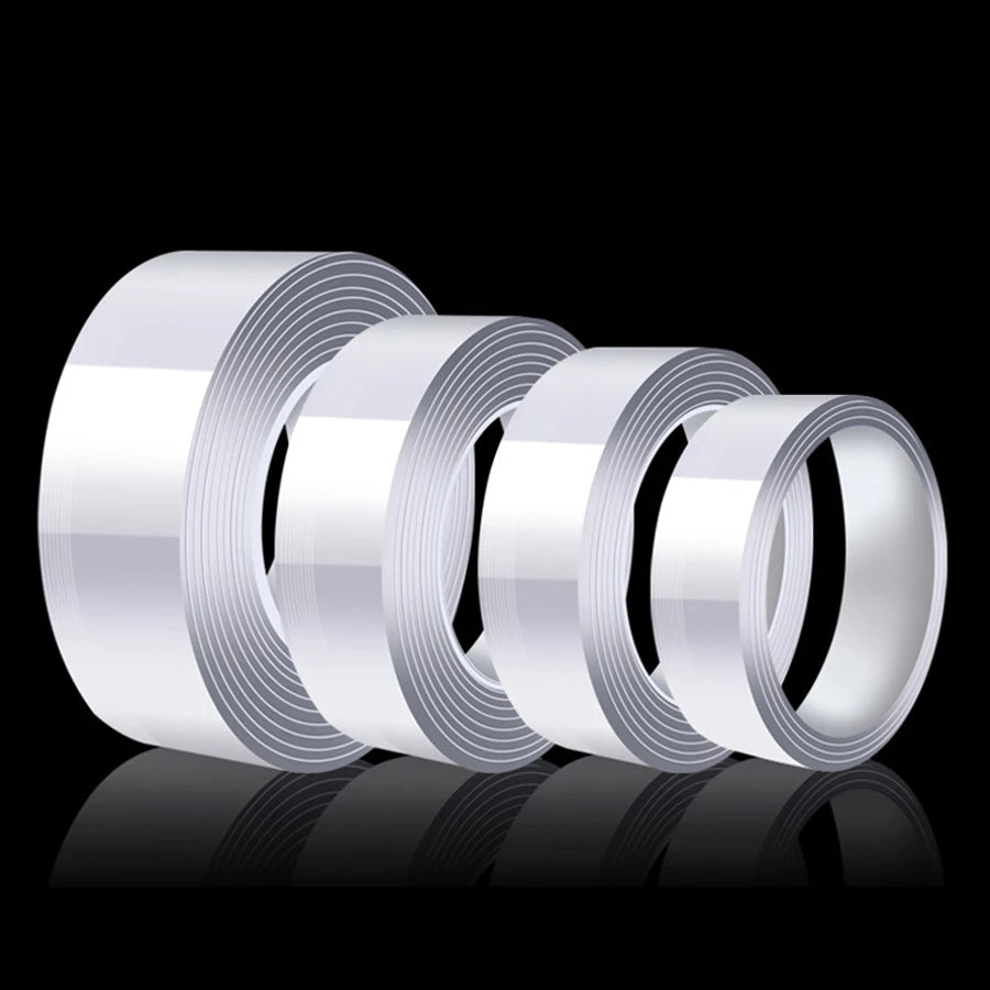 Rolls of heavy duty nano double-sided adhesive tape displayed on a reflective surface.