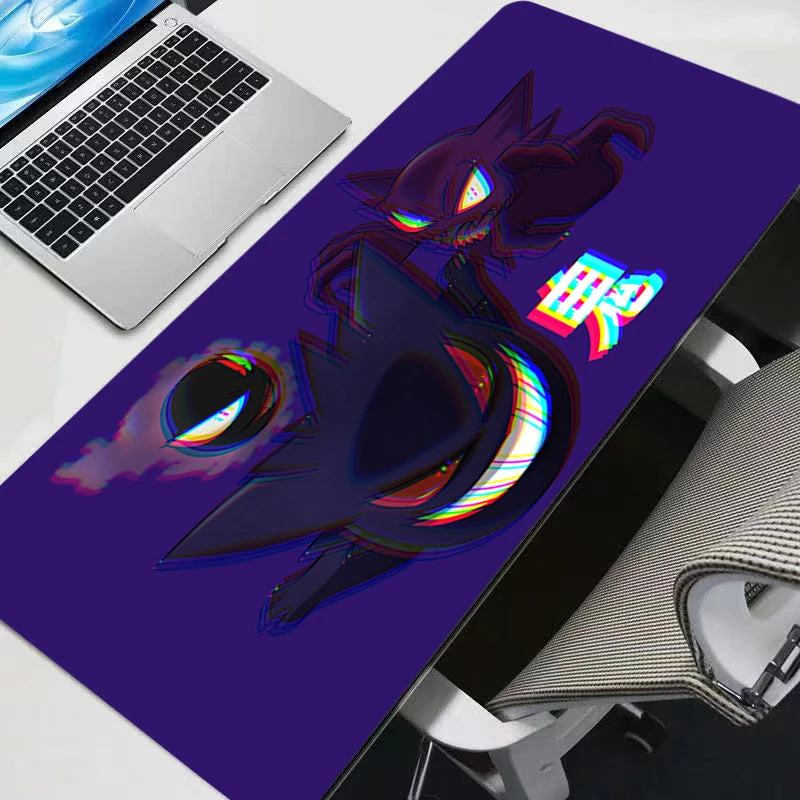 A purple gaming mouse pad featuring a vibrant, stylized Gengar character print on a white laptop surface.