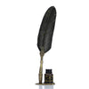 A black feather dip pen set with a gold-colored decorative box and stand.