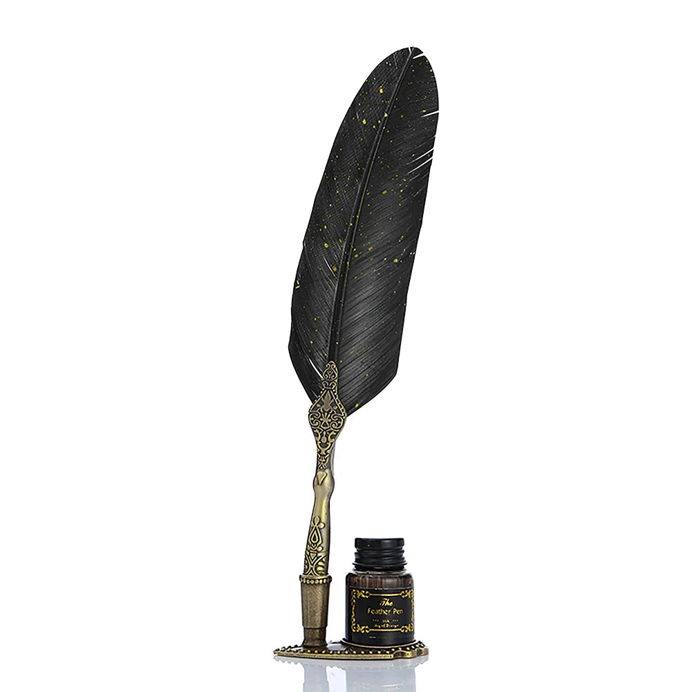 A black feather dip pen set with a gold-colored decorative box and stand.