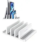 A white 3-slot vertical laptop stand organizer holding several electronic devices.