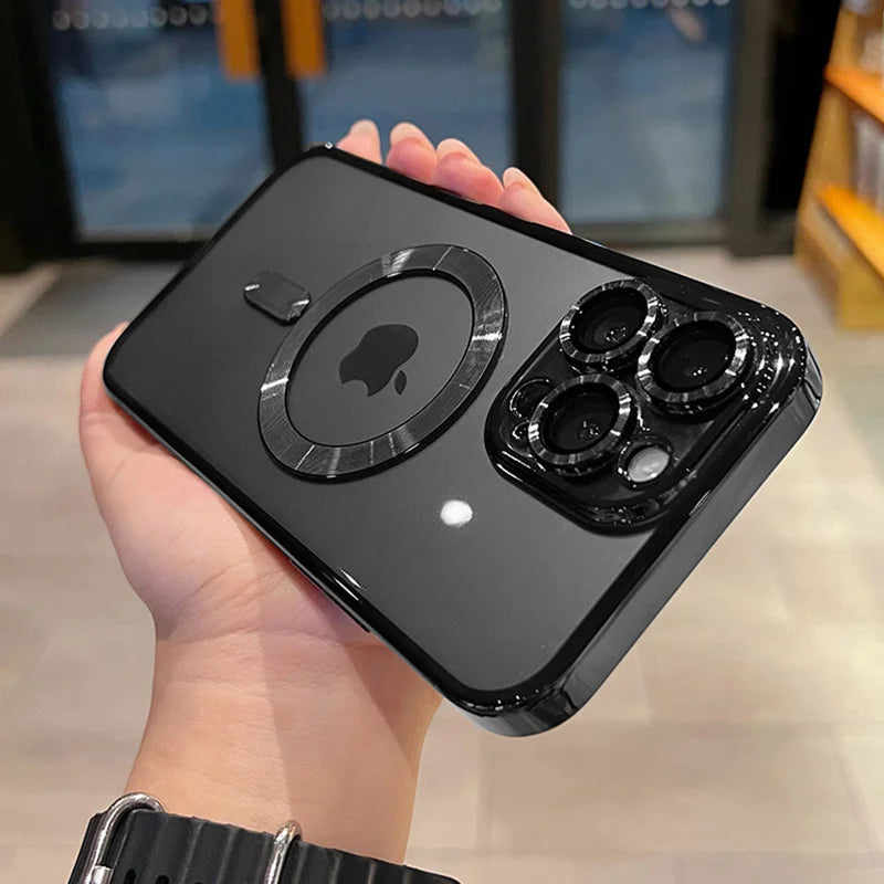 A hand holds a black iPhone with a magnetic clear case featuring a plated finish and multiple camera lenses.