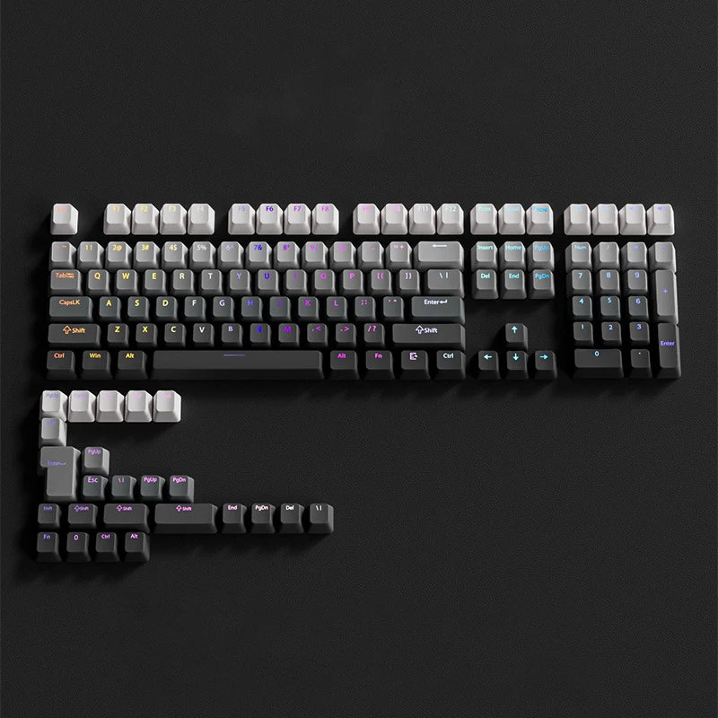 A close-up view of a gradient PBT keycap set for mechanical keyboards arranged on a dark surface.