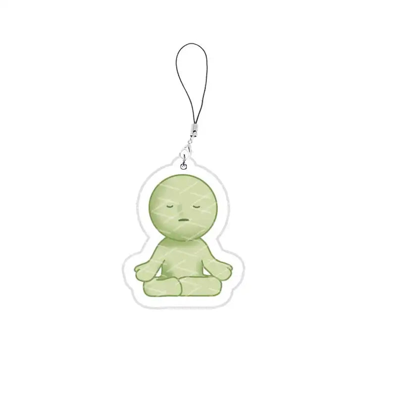 A light green, blob-like character charm attached to a silver keychain ring.