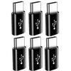 A set of four black USB-C to Micro USB adapters for charging and data sync.