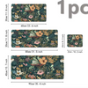 A large floral design mouse pad featuring dark green foliage and orange, pink, and white flowers.