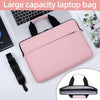 A pink laptop bag with black straps is shown next to a laptop and a tablet.