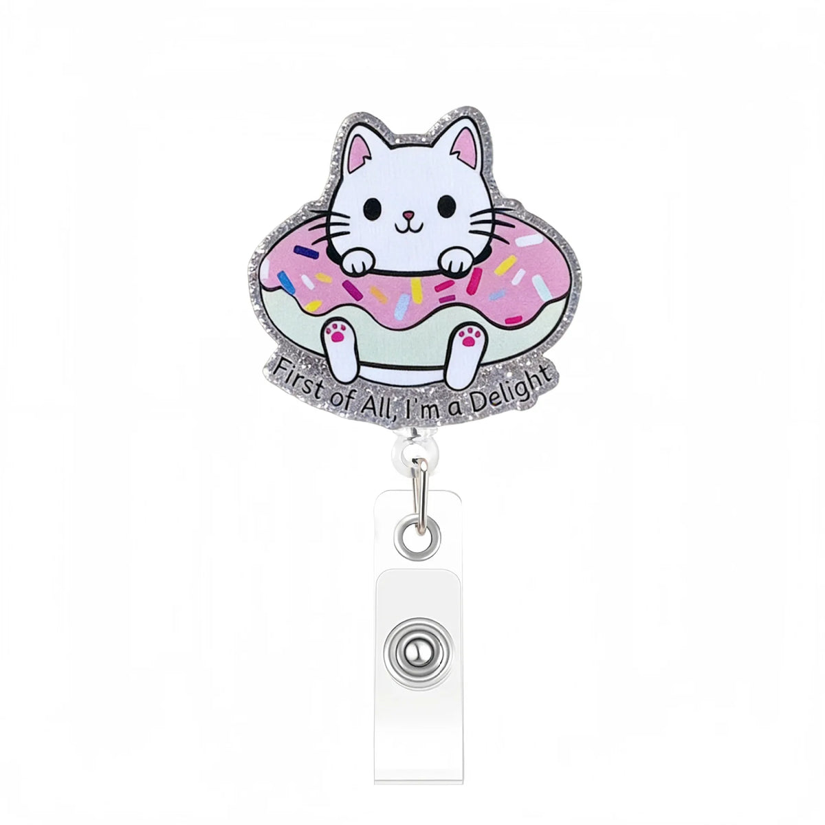 A cute cat charm on an acrylic nurse badge reel with a pink and white design.