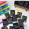 A set of high-gloss acrylic marker pens in various colors and shades displayed on a white surface.