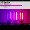 Two retro Edison style LED bulbs glowing in purple and pink light against a dark background.