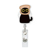 A gold and black crocodile-shaped retractable ID badge holder with a silver clip.