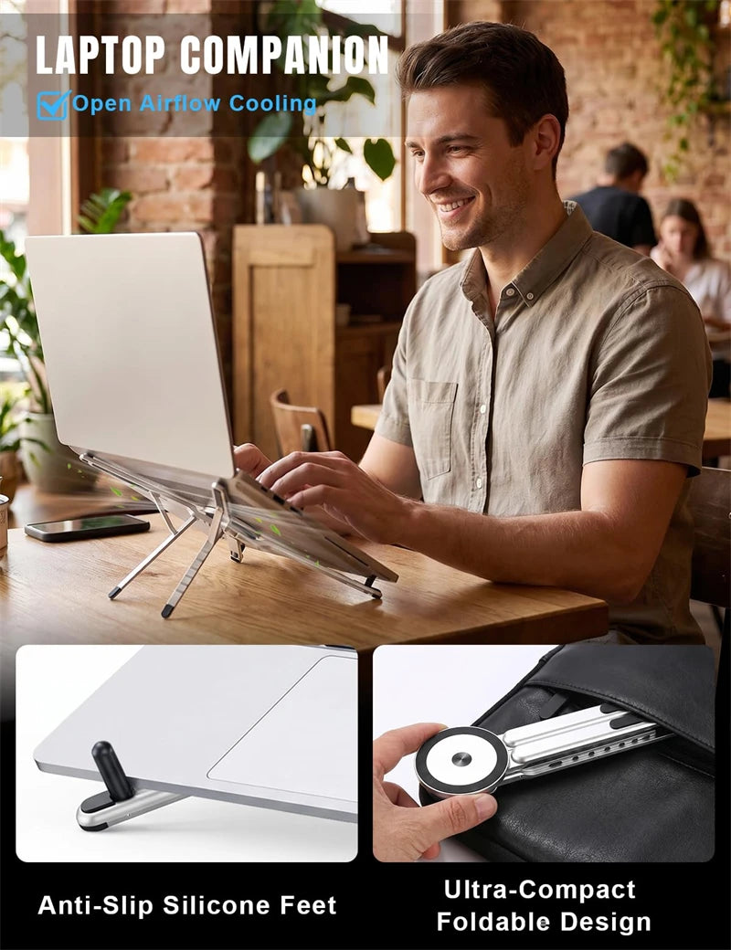 A man is using a laptop companion mount to hold a silver laptop and a smartphone on a wooden table.