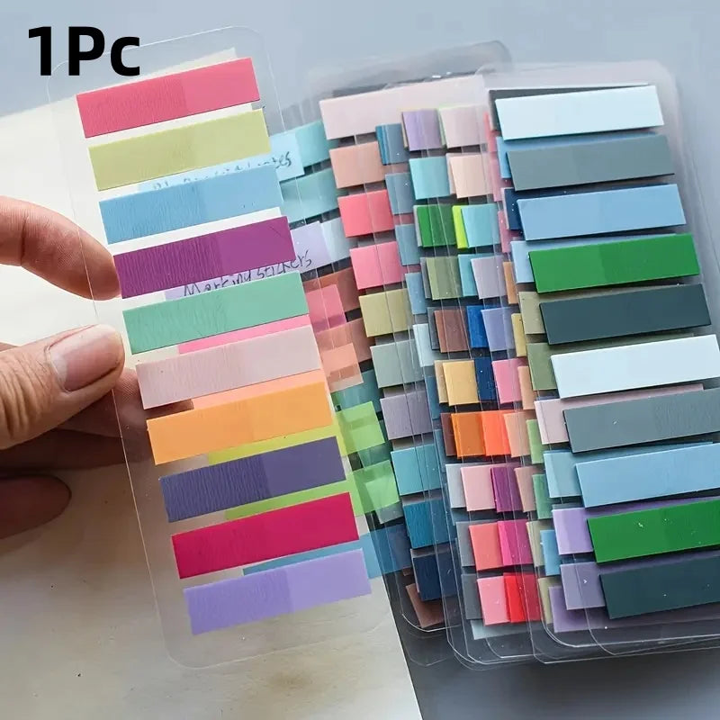 A collection of colorful fluorescent transparent tabs in various shades are displayed in plastic packaging.