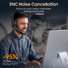 A man wearing a gray shirt is using an ENC noise cancellation headset while working on a laptop.
