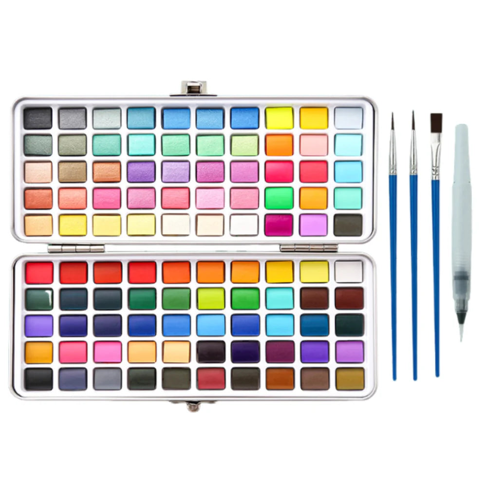 A silver palette containing numerous watercolor paint pans and brushes for artistic use.