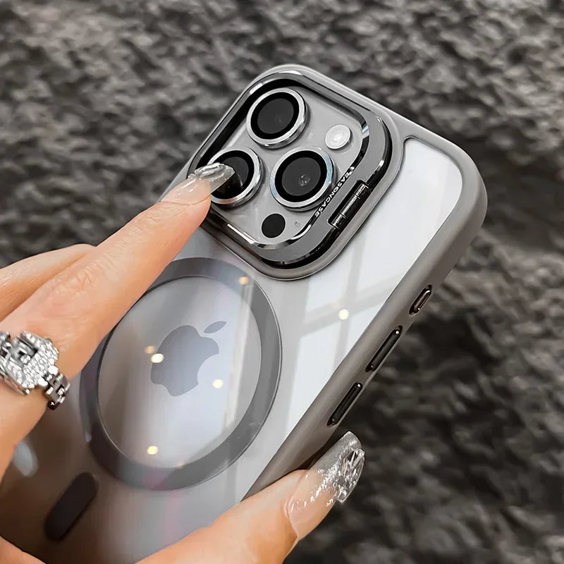 A hand holds a gray magnetic shockproof phone case for an iPhone, showing the camera module and back design.