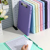 A collection of colorful A4 document and photo storage file boxes lined up on a white desk.