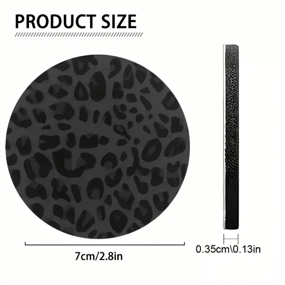 A black leopard print non-slip leather car cup holder coaster with a textured edge.