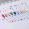 A set of reusable magnetic dry erase markers in various colors writing numbers on a white board.