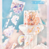 A set of sheer PET tape with a cloud pattern design displayed on an antique white column.
