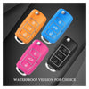 Four realistic fake car keys in orange, blue, pink, and black waterproof versions shown against a dark background