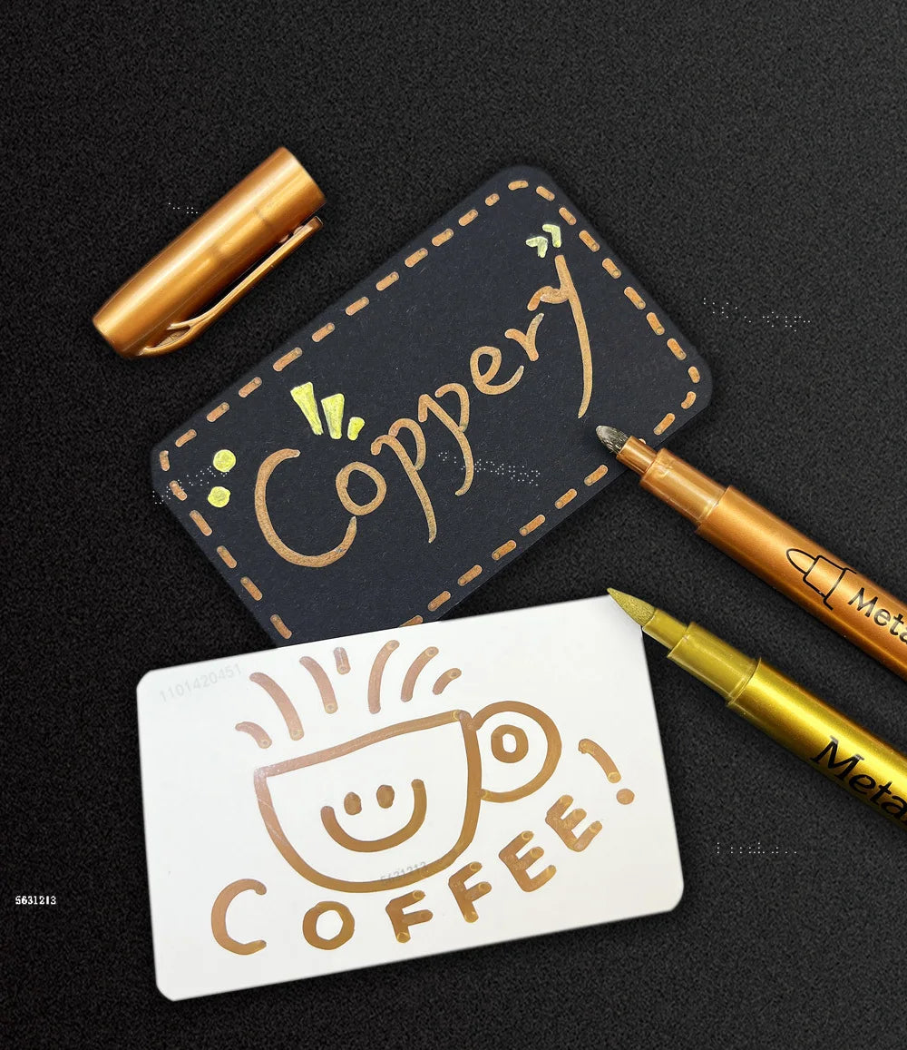 A set of metallic brush marker pens and a tag with the word Copper on a black background.