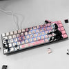 A close-up view of a mechanical keyboard featuring custom anime themed PBT keycaps in pink, black, and white.