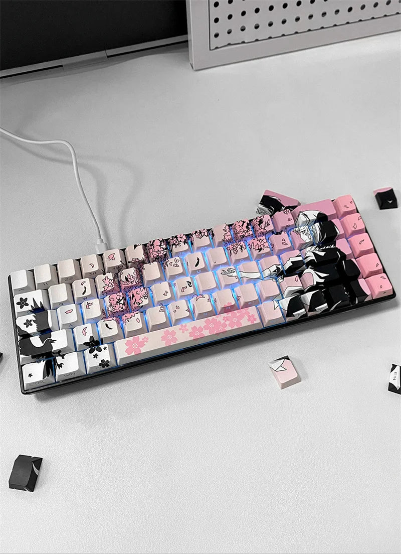 A close-up view of a mechanical keyboard featuring custom anime themed PBT keycaps in pink, black, and white.