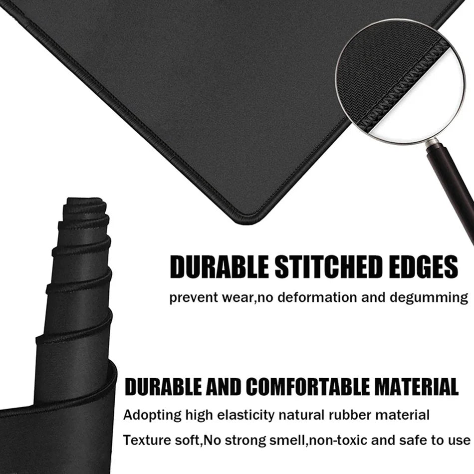 Black desk mat with stitched edges and a magnifying glass showing durable material texture