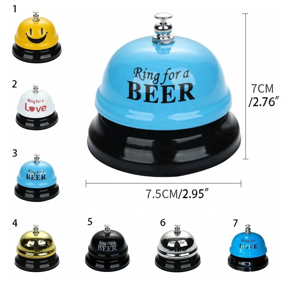 A set of seven classic metal service bells for desk or counter, featuring designs like a smiling face, a heart, and text.