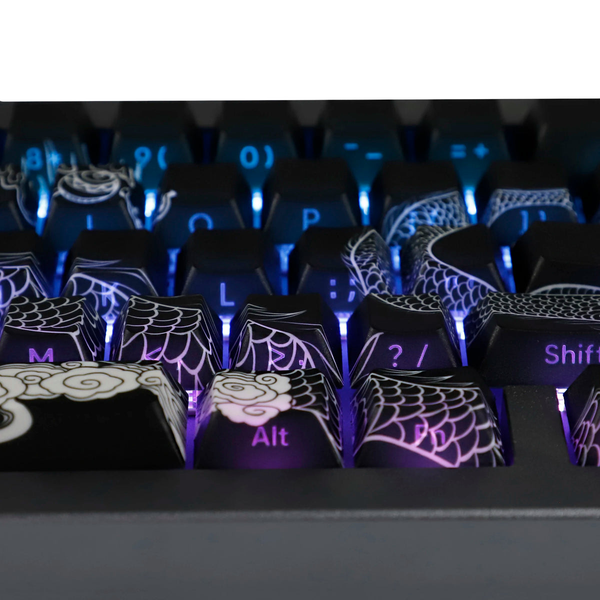 Close-up view of black PBT keycaps with dragon designs and purple lighting on a keyboard layout.
