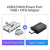 A silver multi-port USB 3.0 hub with a clip and a black OTG adapter are shown.