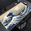 Extra-large mouse pad featuring a detailed illustration of The Great Wave of Kanagawa in blue and white.