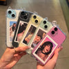A hand holds several clear silicone cases for an iPhone, featuring various designs and colors.