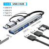 A silver USB-C hub featuring USB 2.0, USB 3.0, and Type-C ports, including a power delivery port.