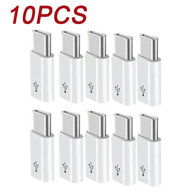 Ten silver USB Type-C to Micro USB adapter converters arranged in a row.