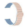 A beige adjustable magnetic loop watch band shown in a curved shape.
