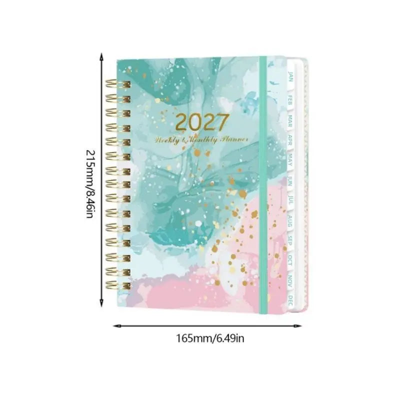 A5 spiral bound planner with monthly tabs featuring a watercolor design in teal, pink, and gold accents.